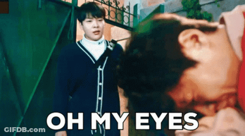 A Man Standing Next To A Woman With The Words Oh My Eyes Written On The Bottom GIF
