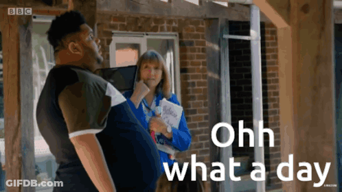 A Man Standing Next To A Woman With The Words Ohh What A Day GIF
