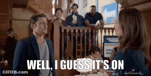 A Man Standing Next To A Woman With The Words Well I Guess It 'S On On The Bottom GIF