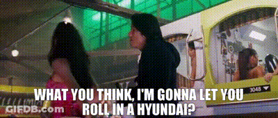 A Man Standing Next To A Woman With The Words What You Think I 'M Gonna Let You Roll In A Hyundai ? GIF