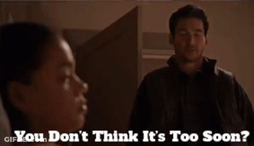 A Man Standing Next To A Woman With The Words " You Don 'T Think It 'S Too Soon " On The Bottom GIF