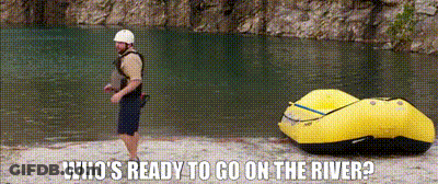 A Man Standing Next To A Yellow Raft With The Words Who 'S Ready To Go On The River GIF