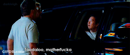 A Man Standing Next To Another Man In A Car With The Words Toodaloo Motherfucka Written On The Screen GIF