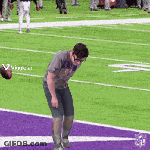 A Man Standing On A Football Field With A Viggle.ai Logo In The Corner GIF
