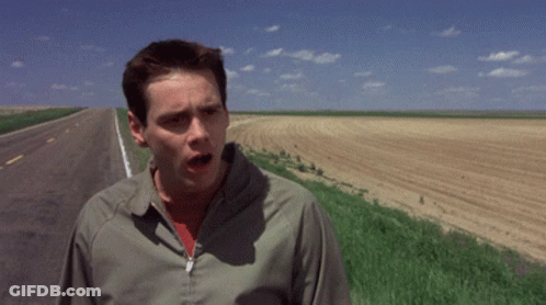 A Man Standing On The Side Of A Road With The Words " Oh Well " Above Him GIF