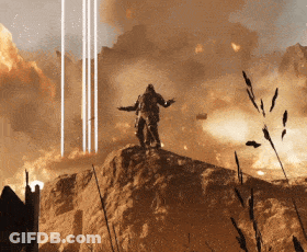 A Man Standing On Top Of A Rock With His Arms Outstretched In Front Of An Explosion GIF