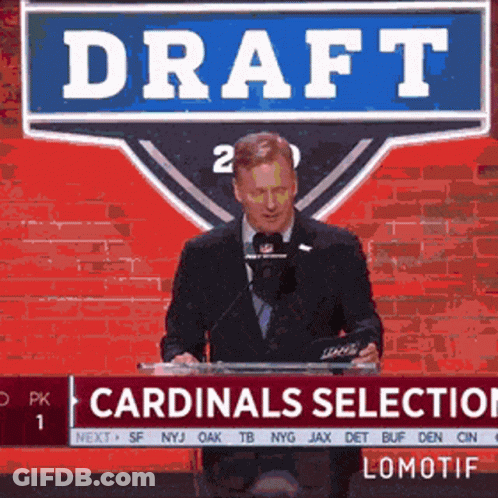 A Man Stands At A Podium With A Sign That Says Draft GIF