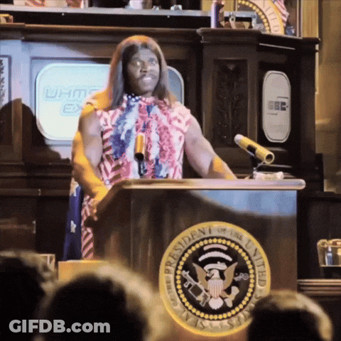 A Man Stands At A Podium With The Seal Of The President Of The United States In Front Of Him GIF