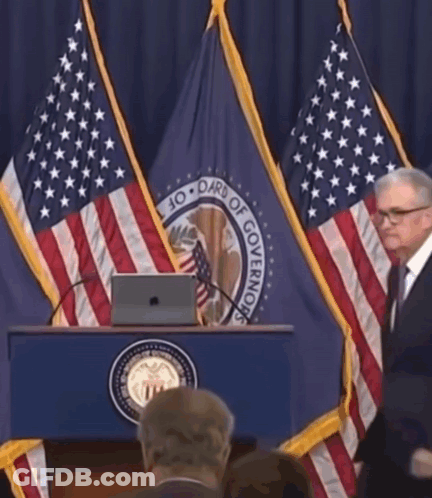 A Man Stands Behind A Podium That Says Board Of Governing GIF