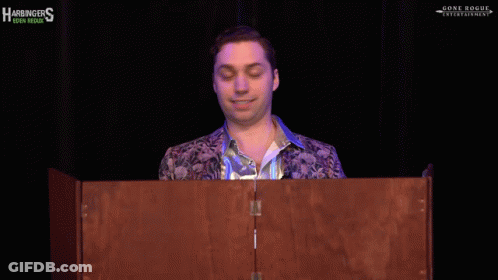 A Man Stands Behind A Podium That Says Just Wow On It GIF