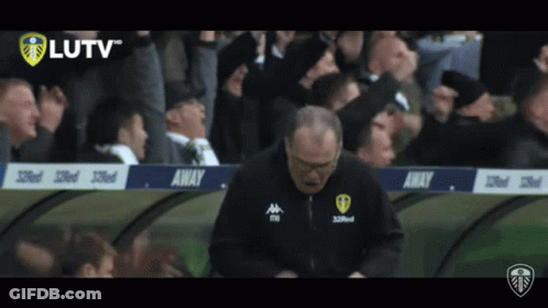 A Man Stands In Front Of A Banner That Says Away On It GIF