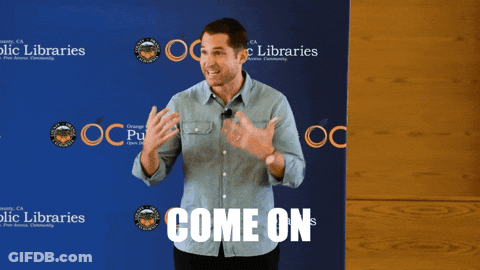 A Man Stands In Front Of A Blue Backdrop That Says Come On GIF