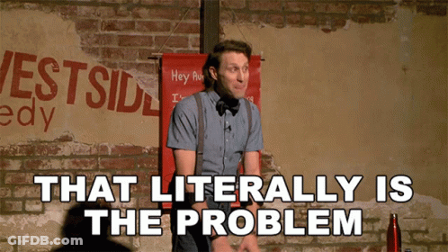 Man Standing In Front Of Brick Wall That Is The Problem GIF