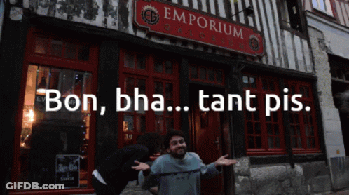 A Man Stands In Front Of A Building That Says Emporium On It GIF