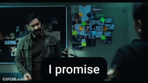A Man Stands In Front Of A Bulletin Board That Says I Promise On It GIF