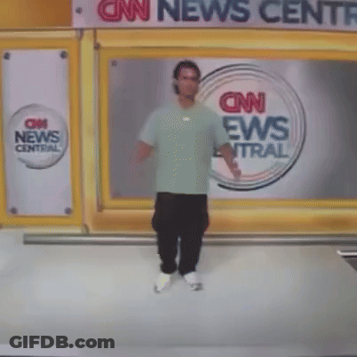 A Man Stands In Front Of A Cnn News Central Sign GIF