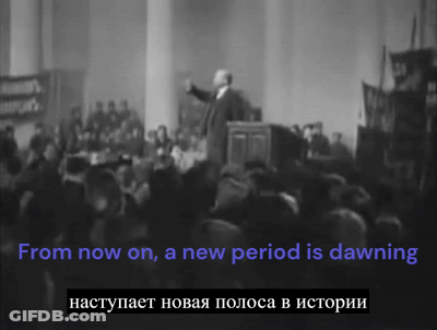 A Man Stands In Front Of A Crowd With The Words From Now On A New Period Is Dawning Below Him GIF