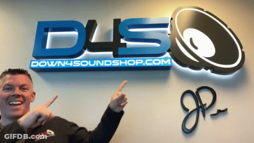 A Man Stands In Front Of A Down4soundshop.com Logo GIF