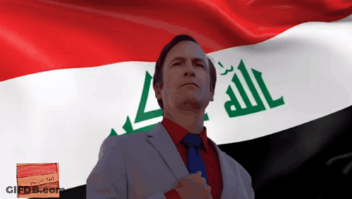 A Man Stands In Front Of A Flag That Says Allah GIF