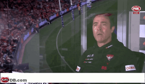 A Man Stands In Front Of A Fox Live Advertisement GIF