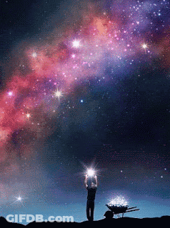 A Man Stands In Front Of A Galaxy With A Wheelbarrow Full Of Stars In The Foreground GIF