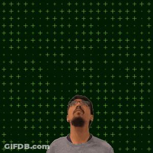A Man Stands In Front Of A Green Background With The Number 19 + 15 On It GIF
