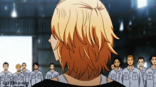 A Man Stands In Front Of A Group Of Men Wearing Uniforms With The Letter T On The Front GIF