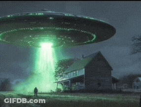 A Man Stands In Front Of A House While An Ufo Flies Overhead GIF