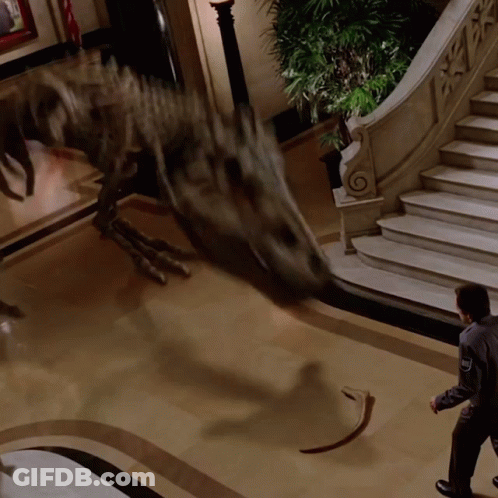 Man Standing In Front Of Dinosaur GIF