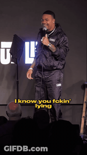 A Man Stands In Front Of A Microphone And Says " I Know You Fckin Lying " GIF