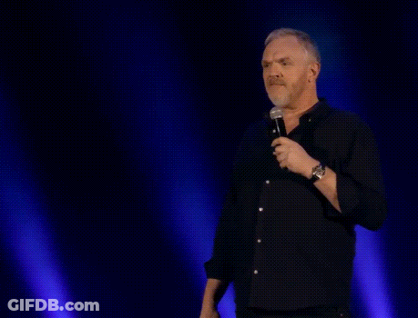 A Man Stands In Front Of A Microphone With The Words Gut Instinct Says " No " Above Him GIF