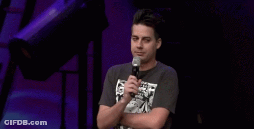 A Man Stands In Front Of A Microphone With The Words I Ain 'T Prayin ' For That Behind Him GIF