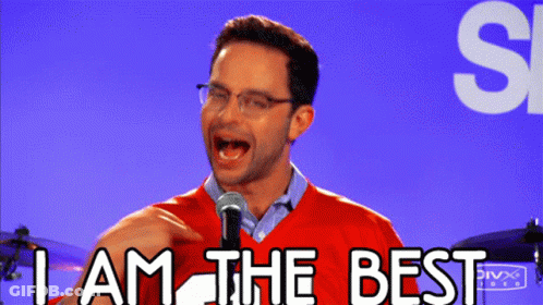 A Man Stands In Front Of A Microphone With The Words " I Am The Best " Above Him GIF
