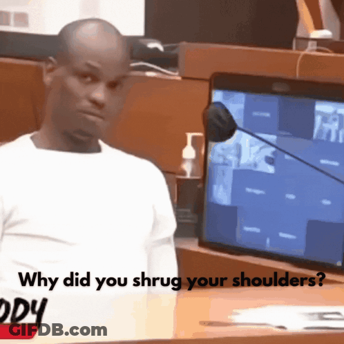 A Man Stands In Front Of A Microphone With The Words " Why Did You Shrug Your Shoulders " On The Bottom GIF