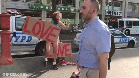 A Man Stands In Front Of A Nypd Van GIF