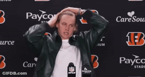 A Man Stands In Front Of A Paycor Stadium Sign GIF