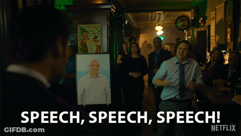 A Man Stands In Front Of A Picture Of A Man And Says Speech Speech Speech Netflix GIF