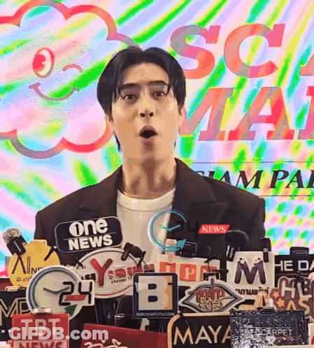 Man At Podium With Microphones And One News Sign GIF