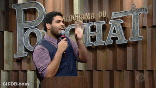 A Man Stands In Front Of A Programa Do Chat Sign GIF