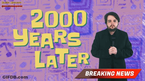 A Man Stands In Front Of A Purple Background With 2000 Years Later Written On It GIF