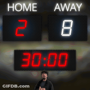 A Man Stands In Front Of A Scoreboard That Says Home 2 And Away 8 GIF