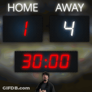 A Man Stands In Front Of A Scoreboard Which Says Home 1 And Away 4 GIF