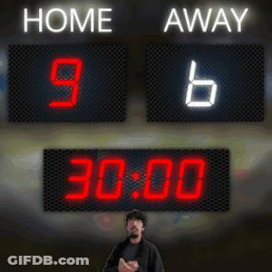 A Man Stands In Front Of A Scoreboard Which Says Home 9 Away 6 GIF