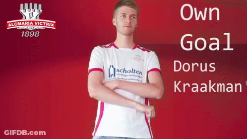 A Man Stands In Front Of A Sign That Says Almaria Victrix 1898 GIF