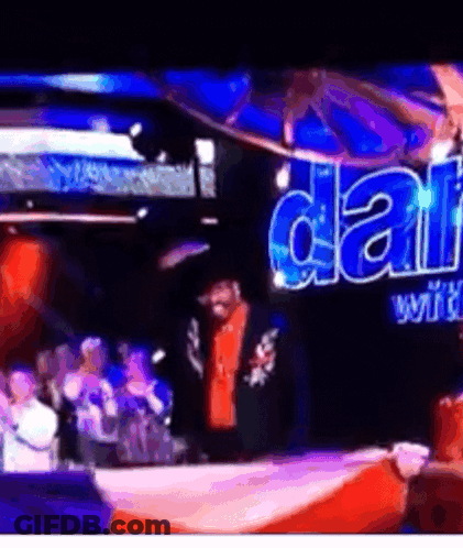 A Man Stands In Front Of A Sign That Says ' Dallas ' On It GIF