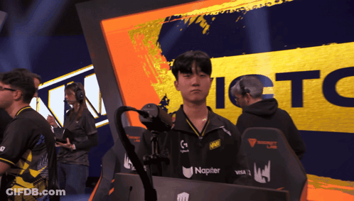A Man Stands In Front Of A Sign That Says Ictc On It GIF