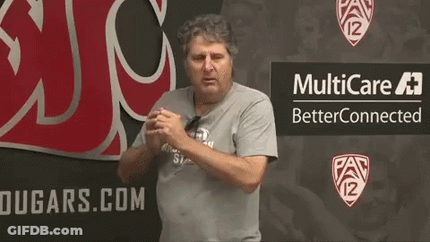 A Man Stands In Front Of A Sign That Says Multicare Betterconnected GIF