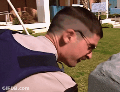 A Man Stands In Front Of A Sign That Says Yuma Calling GIF