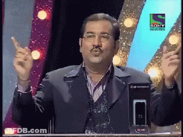 A Man Stands In Front Of A Sony Television Logo GIF