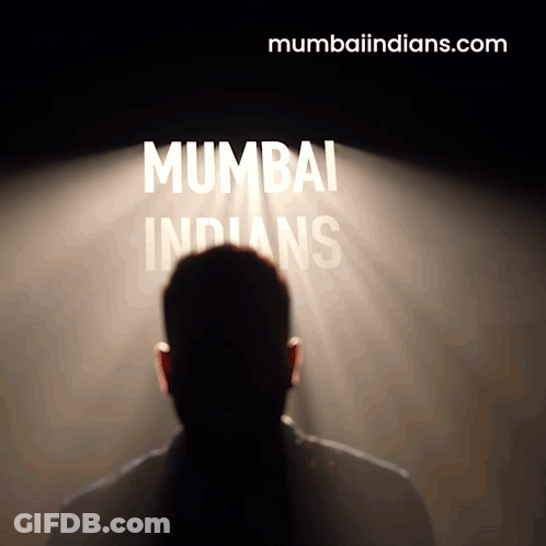 A Man Stands In Front Of A Spotlight That Says Mumbai Indians GIF